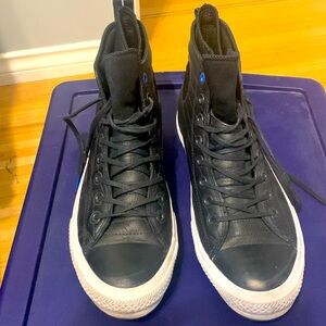 Converse All Star waterproof leather high tops.